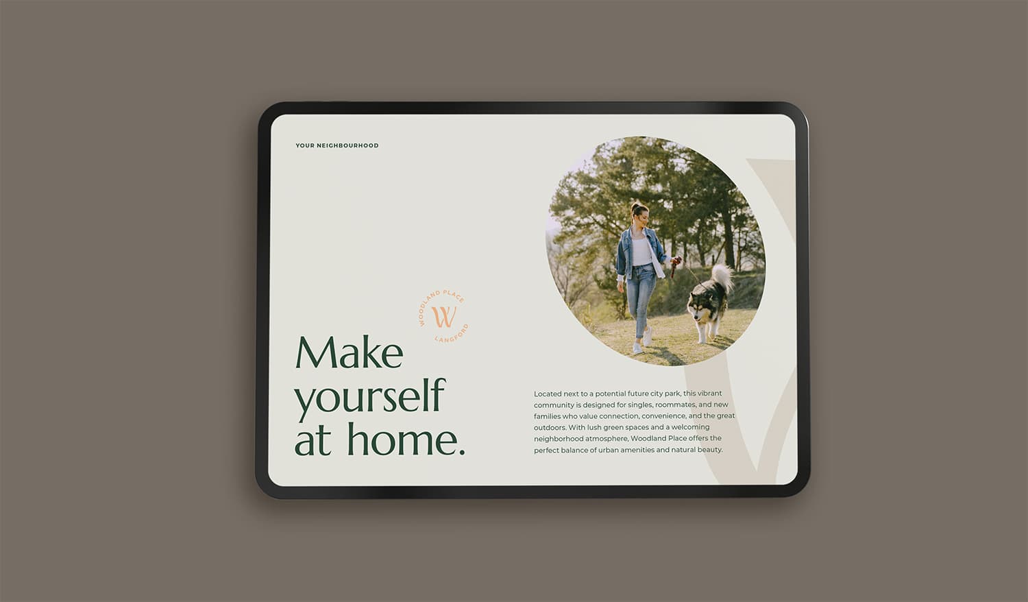 Tablet showing a Woodland Place page headlined 'Make yourself at home.' with a woman walking a dog