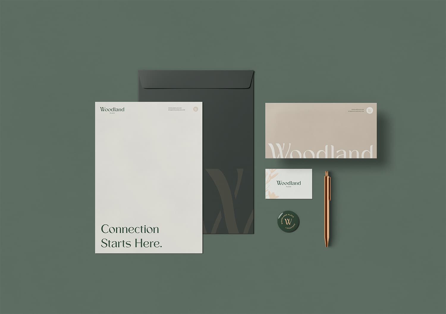 Woodland Place stationery: letterhead reading 'Connection Starts Here.', envelopes, business card, button and pen