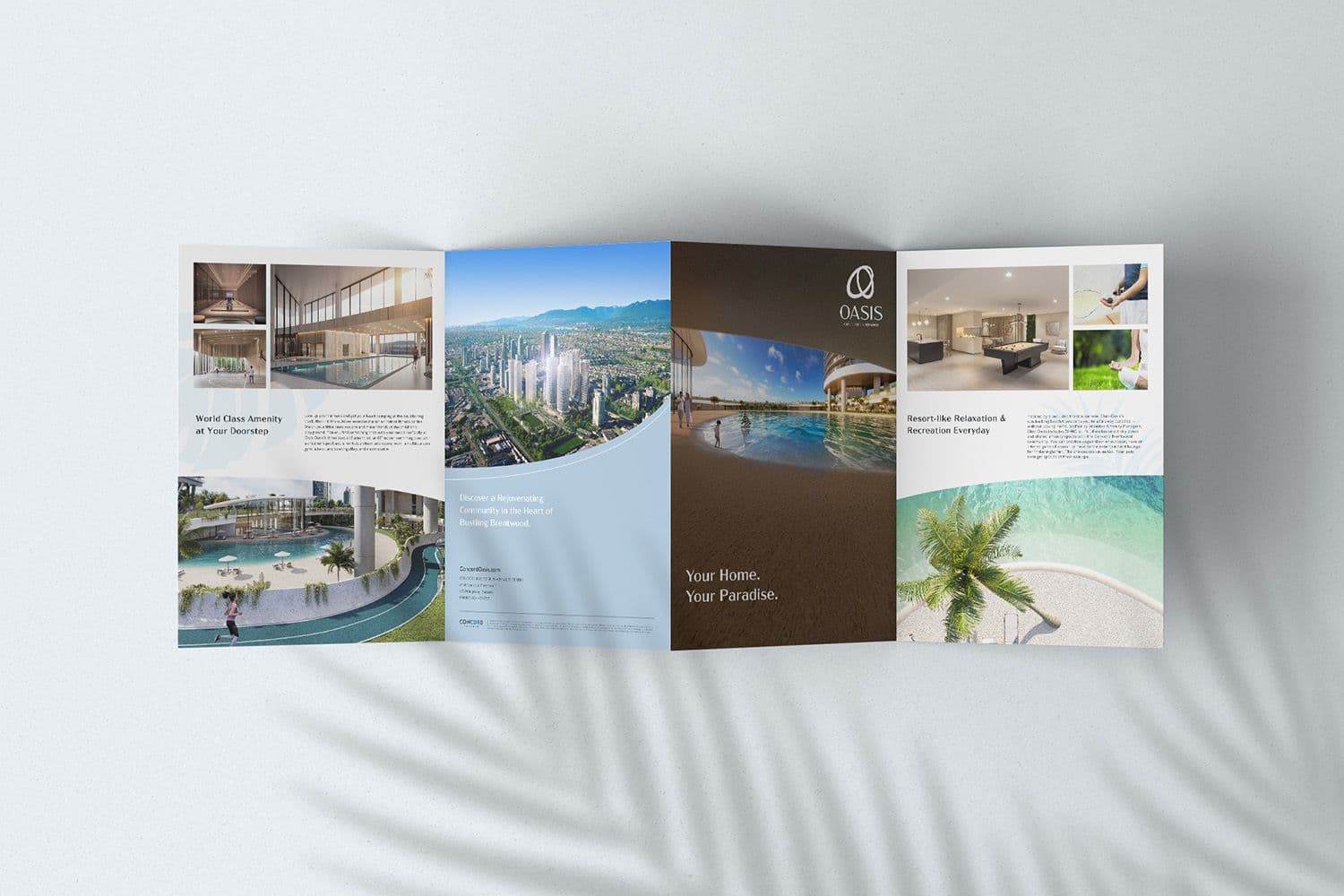 Unfolded Oasis brochure with pool, amenity and skyline images and the line 'Your Home. Your Paradise.'